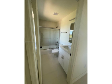 Beautifully remodeled 3BR/2.5BA two-story townhome in the highly on Country Club of Miami in Florida - for sale on GolfHomes.com, golf home, golf lot