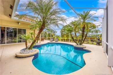 Nestled on a serene one-acre lot along the 6th fairway of on Evergreen Club in Florida - for sale on GolfHomes.com, golf home, golf lot