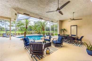 Nestled on a serene one-acre lot along the 6th fairway of on Evergreen Club in Florida - for sale on GolfHomes.com, golf home, golf lot