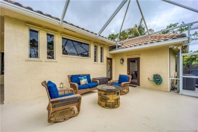 Nestled on a serene one-acre lot along the 6th fairway of on Evergreen Club in Florida - for sale on GolfHomes.com, golf home, golf lot