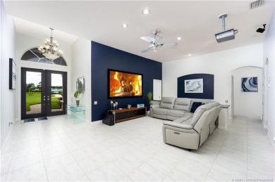 Nestled on a serene one-acre lot along the 6th fairway of on Evergreen Club in Florida - for sale on GolfHomes.com, golf home, golf lot