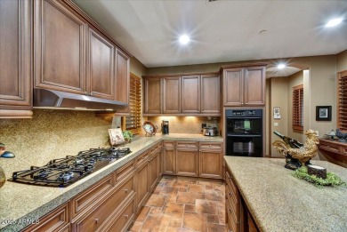 Experience luxurious living offered TURNKEY FURNISHED, (artwork on Superstition Mountain Club - Lost Gold in Arizona - for sale on GolfHomes.com, golf home, golf lot