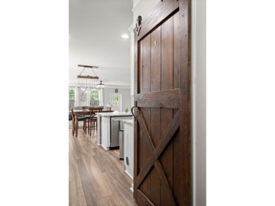 This stunning two-story home combines timeless Lowcountry charm on Cypress Point Par 3 in South Carolina - for sale on GolfHomes.com, golf home, golf lot