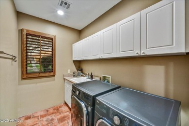Experience luxurious living offered TURNKEY FURNISHED, (artwork on Superstition Mountain Club - Lost Gold in Arizona - for sale on GolfHomes.com, golf home, golf lot