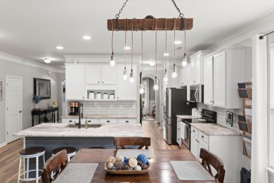 This stunning two-story home combines timeless Lowcountry charm on Cypress Point Par 3 in South Carolina - for sale on GolfHomes.com, golf home, golf lot