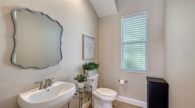 Positioned on a premier south-facing homesite with serene lake on Ritz-Carlton Members Golf Club in Florida - for sale on GolfHomes.com, golf home, golf lot