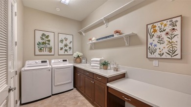 Positioned on a premier south-facing homesite with serene lake on Ritz-Carlton Members Golf Club in Florida - for sale on GolfHomes.com, golf home, golf lot