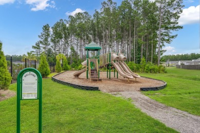 This stunning two-story home combines timeless Lowcountry charm on Cypress Point Par 3 in South Carolina - for sale on GolfHomes.com, golf home, golf lot