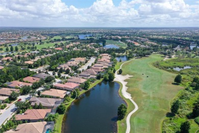 Positioned on a premier south-facing homesite with serene lake on Ritz-Carlton Members Golf Club in Florida - for sale on GolfHomes.com, golf home, golf lot