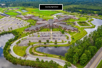 This stunning two-story home combines timeless Lowcountry charm on Cypress Point Par 3 in South Carolina - for sale on GolfHomes.com, golf home, golf lot