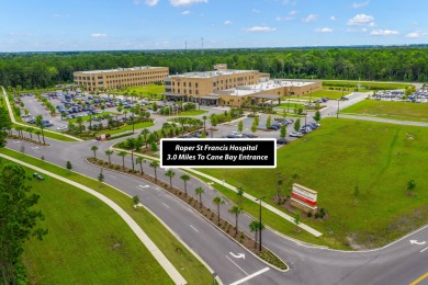 This stunning two-story home combines timeless Lowcountry charm on Cypress Point Par 3 in South Carolina - for sale on GolfHomes.com, golf home, golf lot