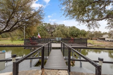 Welcome to your dream waterfront retreat located in the gated on De Cordova Bend Country Club in Texas - for sale on GolfHomes.com, golf home, golf lot