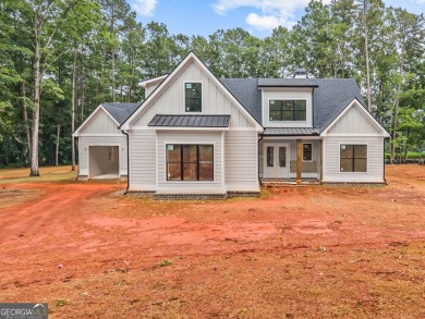 Nestled in the prestigious gated community of Harbor Club on on Harbor Club Golf and Country Club in Georgia - for sale on GolfHomes.com, golf home, golf lot