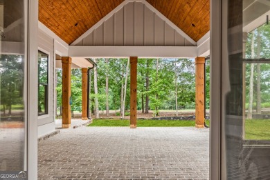 Nestled in the prestigious gated community of Harbor Club on on Harbor Club Golf and Country Club in Georgia - for sale on GolfHomes.com, golf home, golf lot