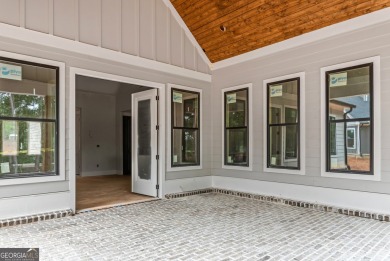Nestled in the prestigious gated community of Harbor Club on on Harbor Club Golf and Country Club in Georgia - for sale on GolfHomes.com, golf home, golf lot