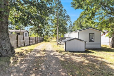 Nestled in a serene lakeside setting, this charming 3-bedroom on Turtle Creek Golf Club in Michigan - for sale on GolfHomes.com, golf home, golf lot