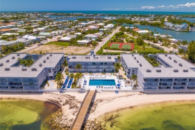 Start your day with a coffee while watching the sunrise over the on Key Colony Beach Golf Course in Florida - for sale on GolfHomes.com, golf home, golf lot