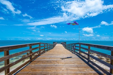 Start your day with a coffee while watching the sunrise over the on Key Colony Beach Golf Course in Florida - for sale on GolfHomes.com, golf home, golf lot