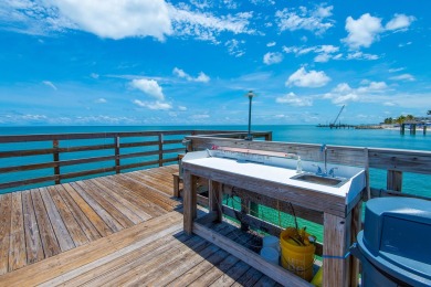 Start your day with a coffee while watching the sunrise over the on Key Colony Beach Golf Course in Florida - for sale on GolfHomes.com, golf home, golf lot