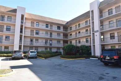 Bright and spacious 2BR/2BA corner unit with views of the on Sunrise Lakes Phase IV Golf Course in Florida - for sale on GolfHomes.com, golf home, golf lot