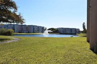 Bright and spacious 2BR/2BA corner unit with views of the on Sunrise Lakes Phase IV Golf Course in Florida - for sale on GolfHomes.com, golf home, golf lot