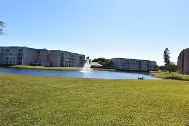Bright and spacious 2BR/2BA corner unit with views of the on Sunrise Lakes Phase IV Golf Course in Florida - for sale on GolfHomes.com, golf home, golf lot