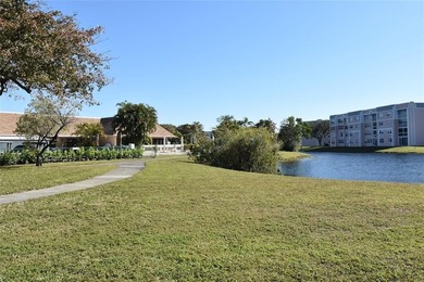 Bright and spacious 2BR/2BA corner unit with views of the on Sunrise Lakes Phase IV Golf Course in Florida - for sale on GolfHomes.com, golf home, golf lot