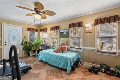 Welcome home to this beautiful contemporary home, spread out on on Canongate At Georgia National Golf Club in Georgia - for sale on GolfHomes.com, golf home, golf lot