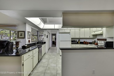 This stunning 3-bedroom, 3-bath pool home in the highly on Timber Pines Golf Course in Florida - for sale on GolfHomes.com, golf home, golf lot