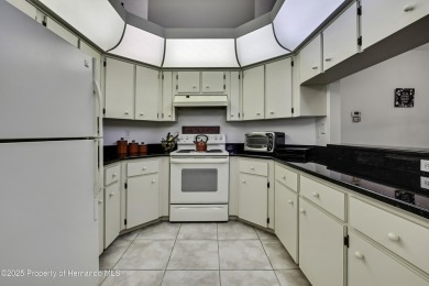 This stunning 3-bedroom, 3-bath pool home in the highly on Timber Pines Golf Course in Florida - for sale on GolfHomes.com, golf home, golf lot