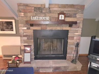 Charming 3-Bedroom Retreat with Seasonal Lake Views & Outdoor on The Hideout Golf in Pennsylvania - for sale on GolfHomes.com, golf home, golf lot