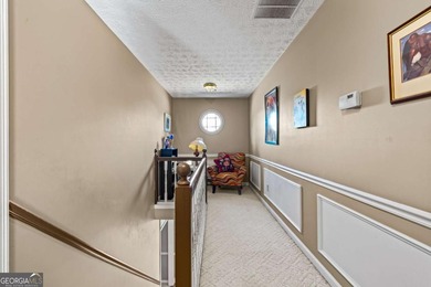 Welcome home to this beautiful contemporary home, spread out on on Canongate At Georgia National Golf Club in Georgia - for sale on GolfHomes.com, golf home, golf lot