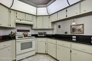 This stunning 3-bedroom, 3-bath pool home in the highly on Timber Pines Golf Course in Florida - for sale on GolfHomes.com, golf home, golf lot