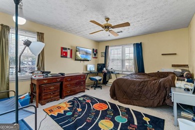 Welcome home to this beautiful contemporary home, spread out on on Canongate At Georgia National Golf Club in Georgia - for sale on GolfHomes.com, golf home, golf lot