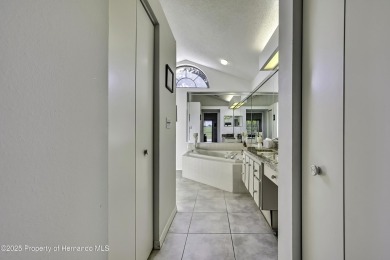 This stunning 3-bedroom, 3-bath pool home in the highly on Timber Pines Golf Course in Florida - for sale on GolfHomes.com, golf home, golf lot