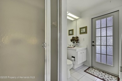 This stunning 3-bedroom, 3-bath pool home in the highly on Timber Pines Golf Course in Florida - for sale on GolfHomes.com, golf home, golf lot