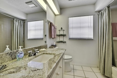This stunning 3-bedroom, 3-bath pool home in the highly on Timber Pines Golf Course in Florida - for sale on GolfHomes.com, golf home, golf lot