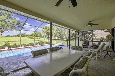 This stunning 3-bedroom, 3-bath pool home in the highly on Timber Pines Golf Course in Florida - for sale on GolfHomes.com, golf home, golf lot