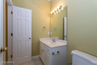 This gorgeous brick home in desirable Pinewild CC is situated on on Pinewild Country Club of Pinehurst in North Carolina - for sale on GolfHomes.com, golf home, golf lot