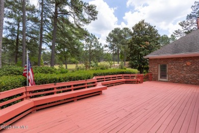 This gorgeous brick home in desirable Pinewild CC is situated on on Pinewild Country Club of Pinehurst in North Carolina - for sale on GolfHomes.com, golf home, golf lot