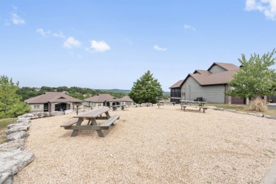 Welcome to your next scenic getaway! This charming two-bedroom on Ledgestone Country Club and Golf Course in Missouri - for sale on GolfHomes.com, golf home, golf lot