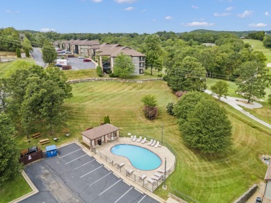 Welcome to your next scenic getaway! This charming two-bedroom on Ledgestone Country Club and Golf Course in Missouri - for sale on GolfHomes.com, golf home, golf lot