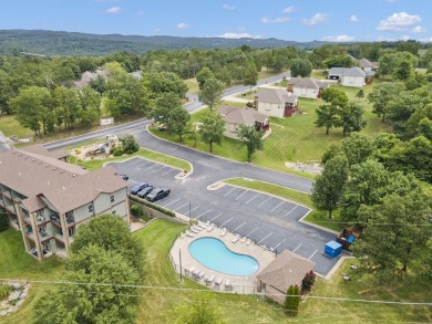 Welcome to your next scenic getaway! This charming two-bedroom on Ledgestone Country Club and Golf Course in Missouri - for sale on GolfHomes.com, golf home, golf lot