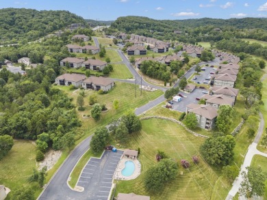 Welcome to your next scenic getaway! This charming two-bedroom on Ledgestone Country Club and Golf Course in Missouri - for sale on GolfHomes.com, golf home, golf lot