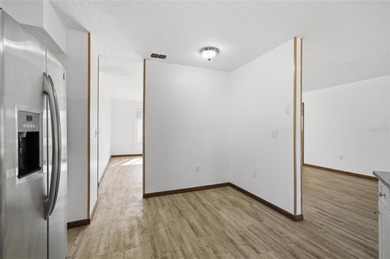 Welcome home to this beautifully updated 2-bedroom, 2-bath gem on The Grand Club - Pine Lakes Course in Florida - for sale on GolfHomes.com, golf home, golf lot