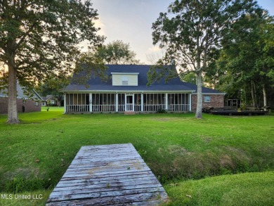 Take a look at this beautiful home located at the end of a on Diamondhead Country Club in Mississippi - for sale on GolfHomes.com, golf home, golf lot