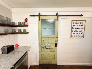 Take a look at this beautiful home located at the end of a on Diamondhead Country Club in Mississippi - for sale on GolfHomes.com, golf home, golf lot