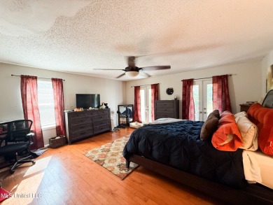 Take a look at this beautiful home located at the end of a on Diamondhead Country Club in Mississippi - for sale on GolfHomes.com, golf home, golf lot