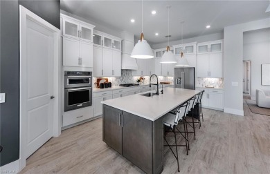Move-in ready and located in the premier gated community of on Valencia Golf and Country Club in Florida - for sale on GolfHomes.com, golf home, golf lot
