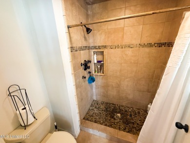 Take a look at this beautiful home located at the end of a on Diamondhead Country Club in Mississippi - for sale on GolfHomes.com, golf home, golf lot